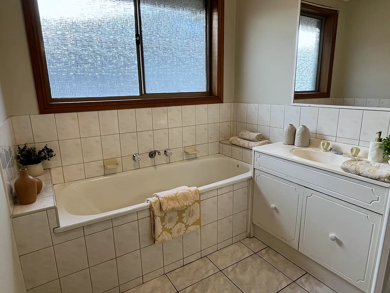 Bathroom styled with towels and greenery in an Altona Meadows home