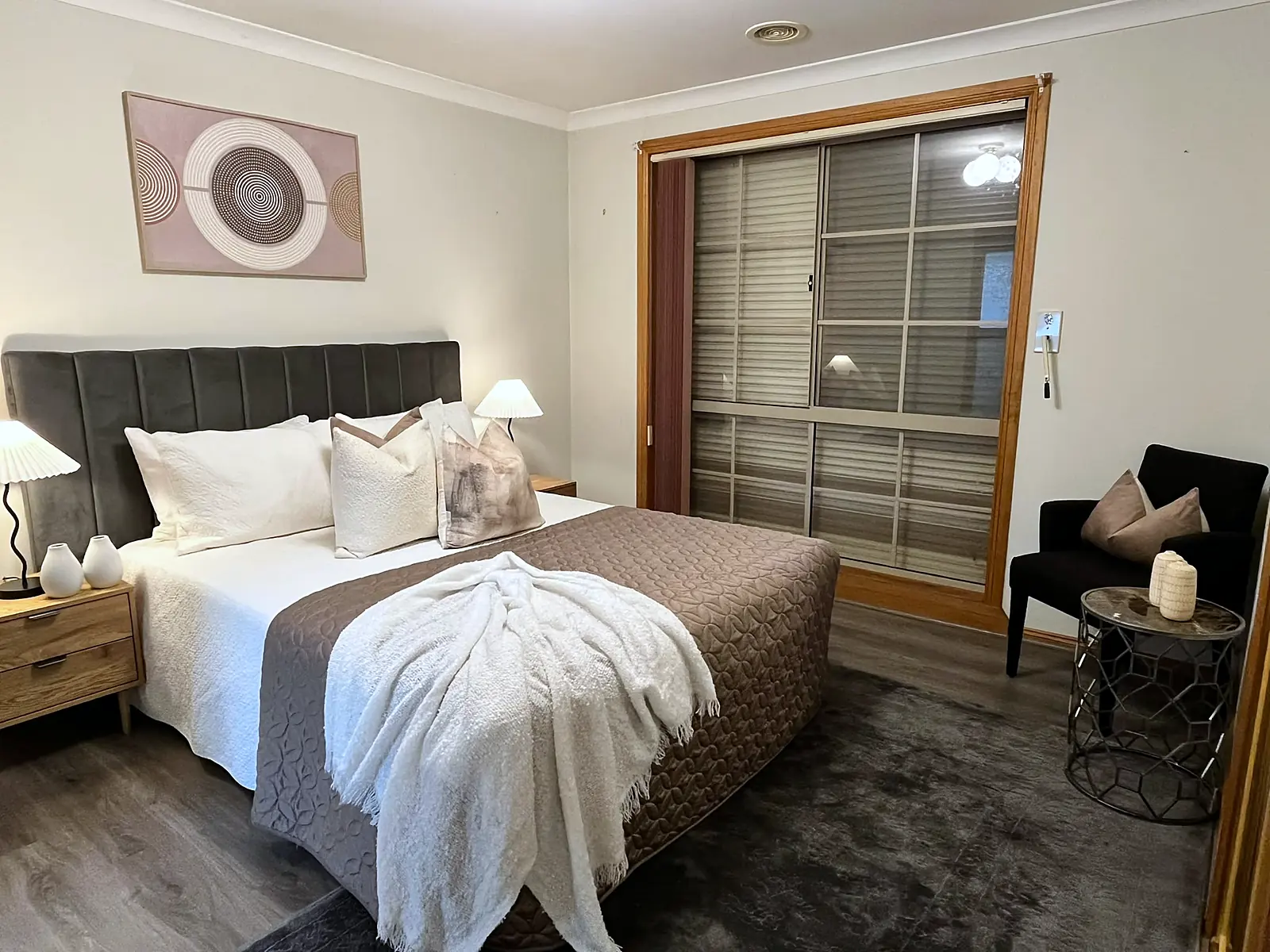 Bedroom styled with artwork and armchair in an Altona Meadows home