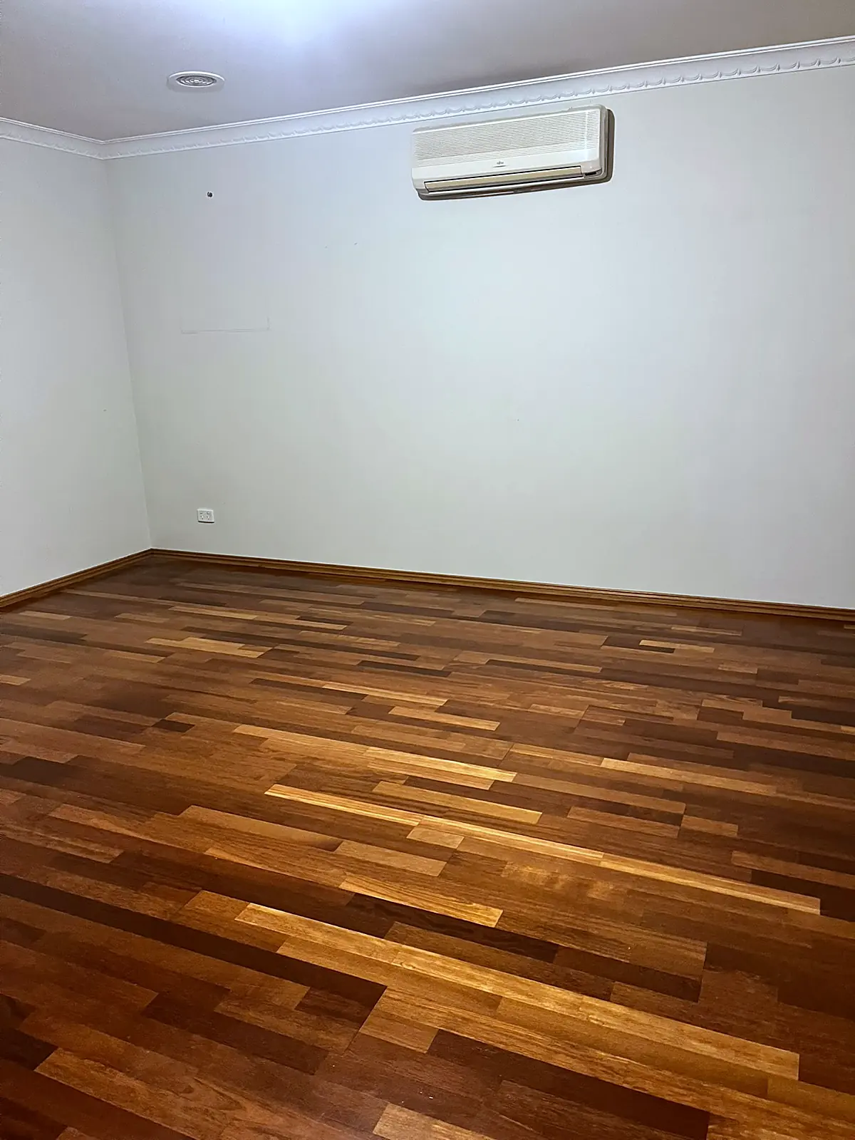 Empty lounge with timber floor before staging in an Altona Meadows home