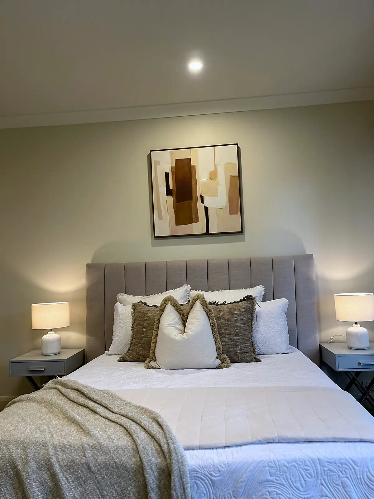 Main bedroom staged with upholstered bedhead and neutral linen in a Balwyn home