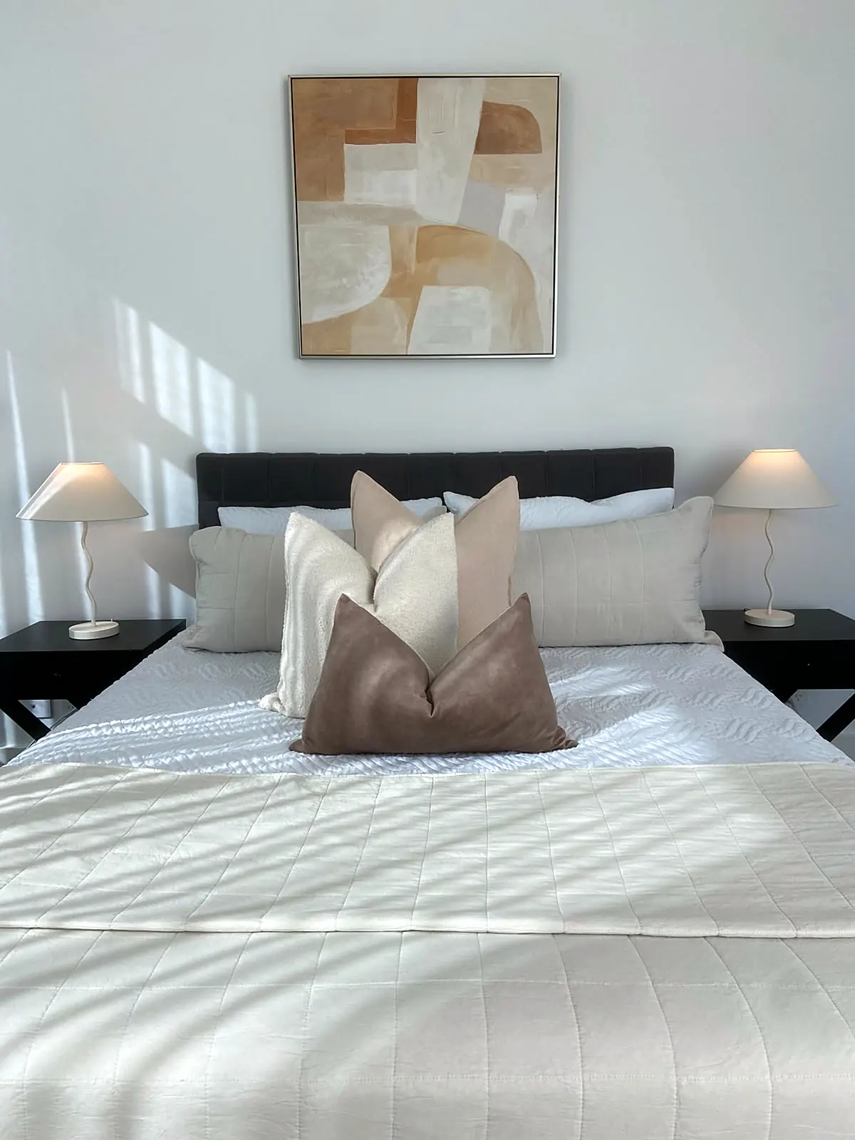 Main bedroom staged with crisp linen and artwork in a Bulleen home