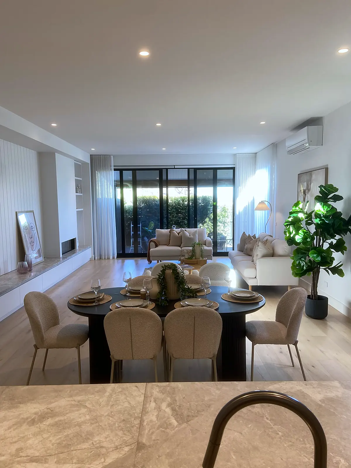 Open-plan dining and living area staged in a Bulleen home