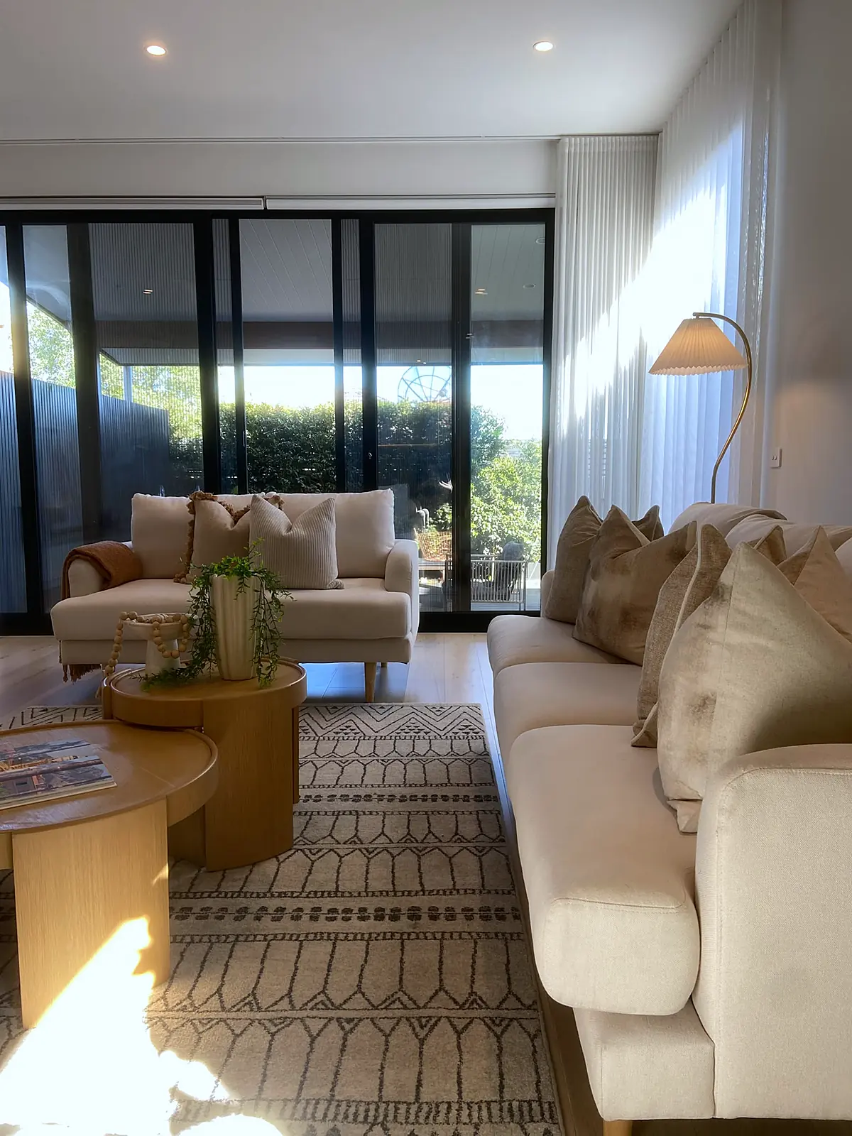 Living room looking toward the balcony doors in a staged Bulleen home