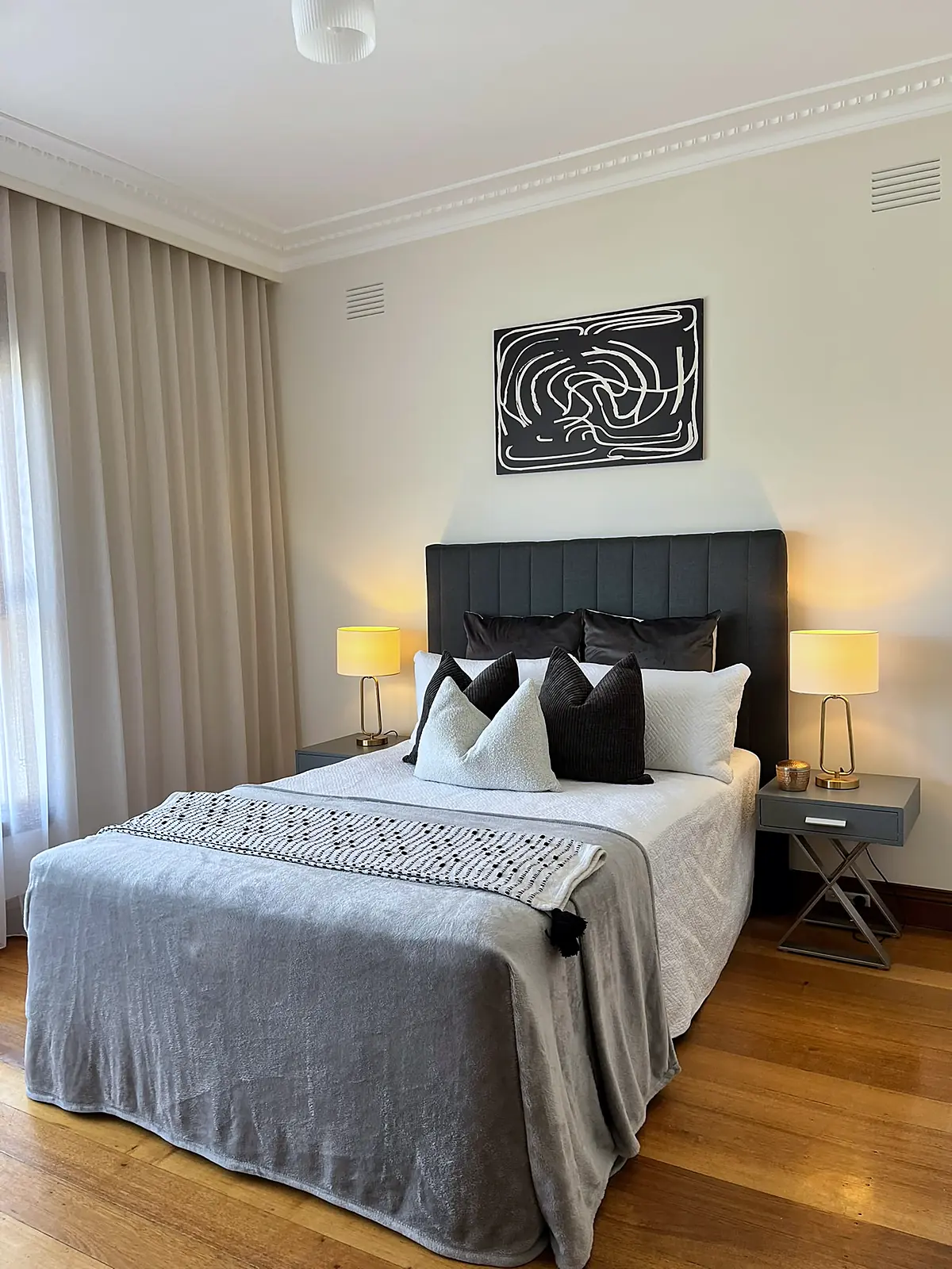 Bedroom staged on polished timber floors in a Chadstone home