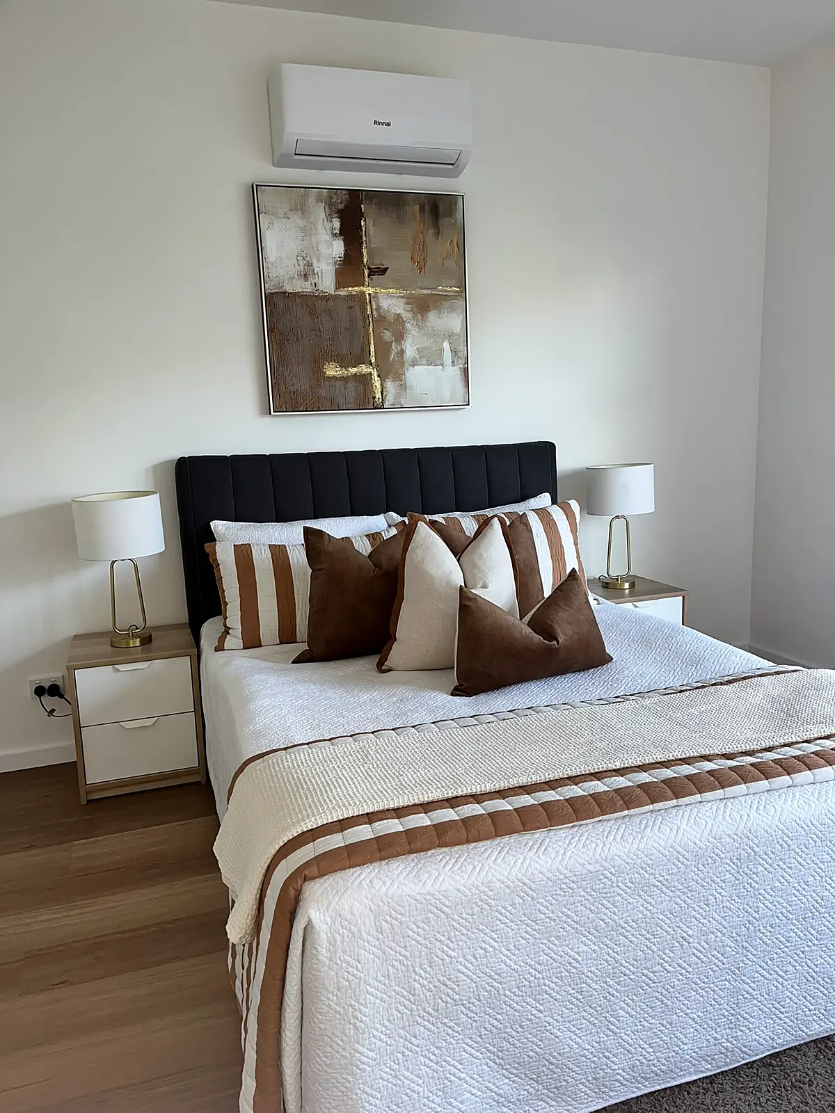 Third bedroom staged with dark bedhead and striped throw in a Craigieburn home