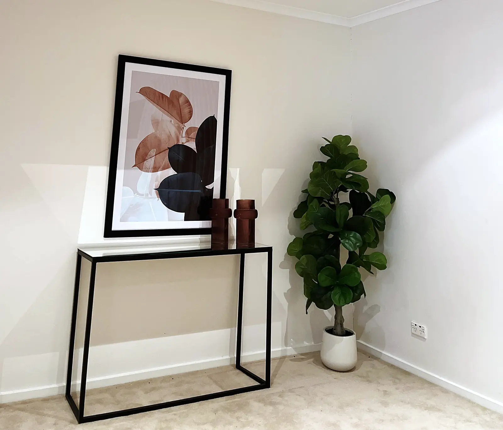 Entry styled with console table, artwork and fiddle leaf fig in a Deer Park home