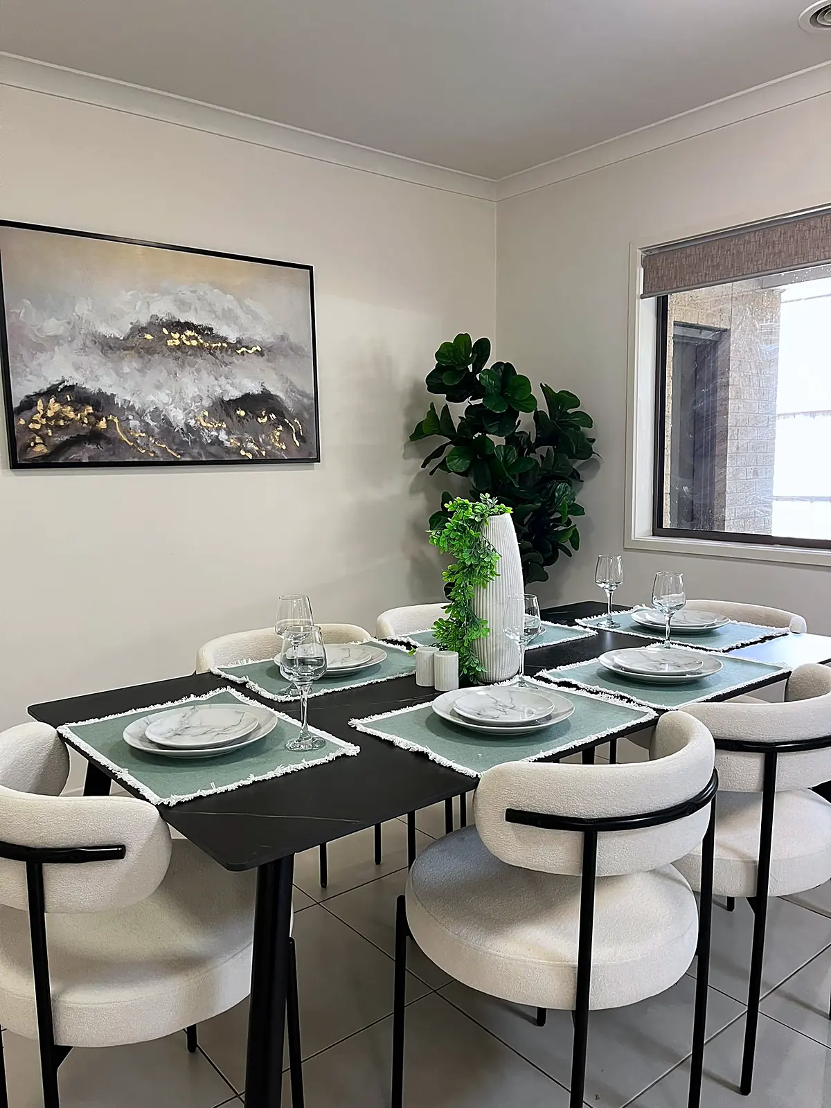 Dining table set with boucle chairs in a staged Doreen home