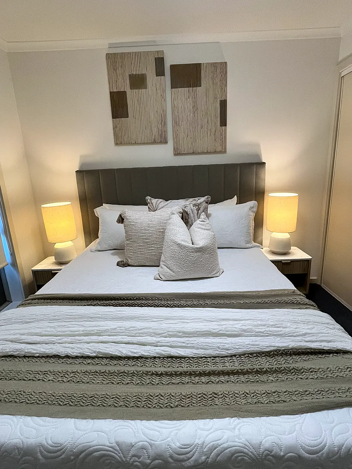 Bedroom staged with neutral linen and textured artwork in an Epping home