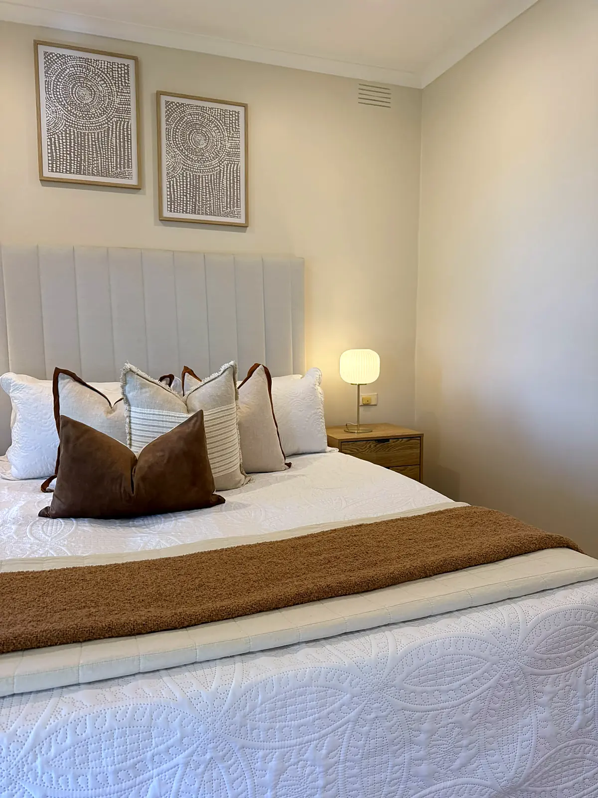 Master bedroom styled with upholstered bedhead in a Frankston home