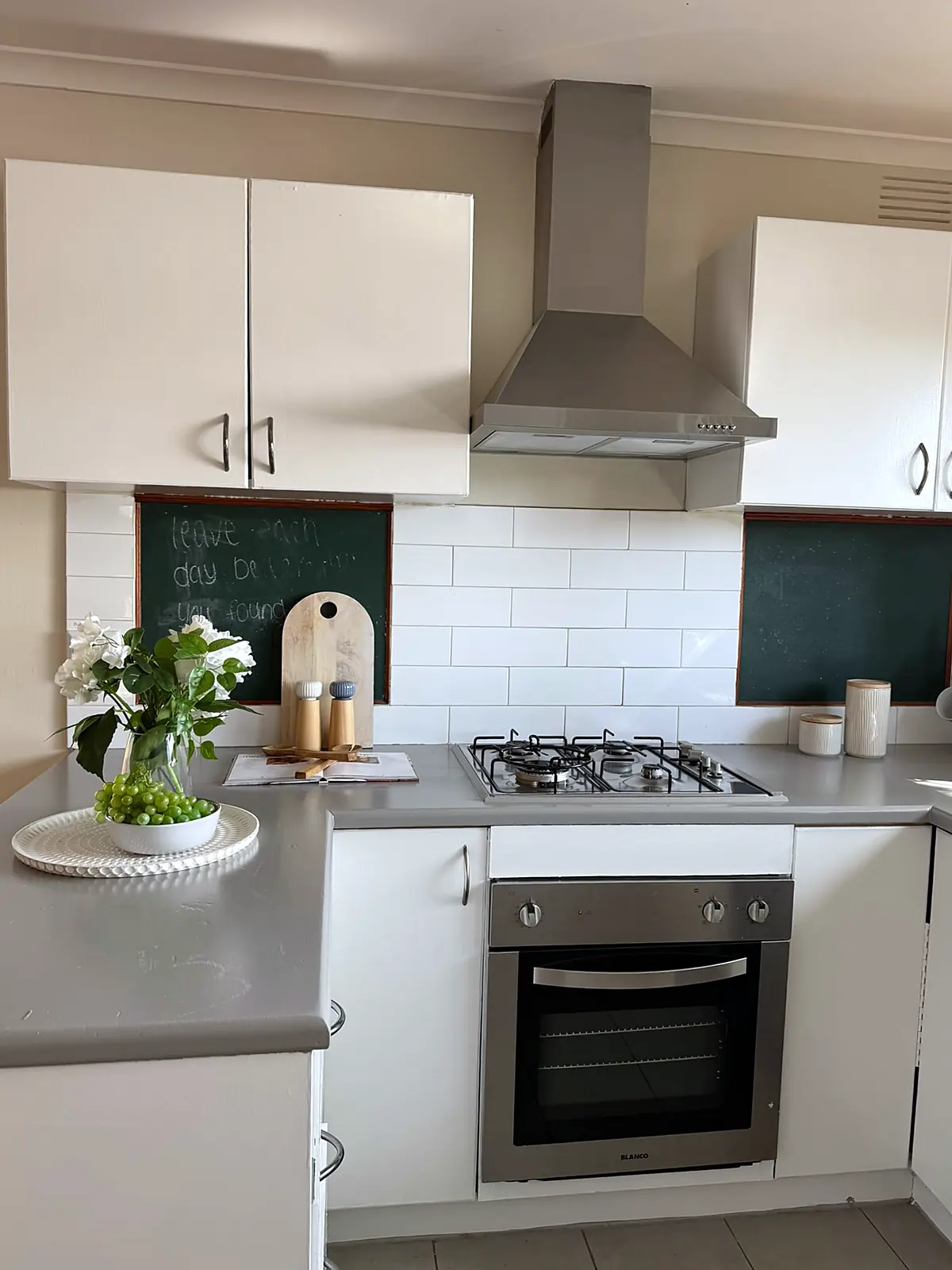 White kitchen with styled benchtop in a staged Frankston home