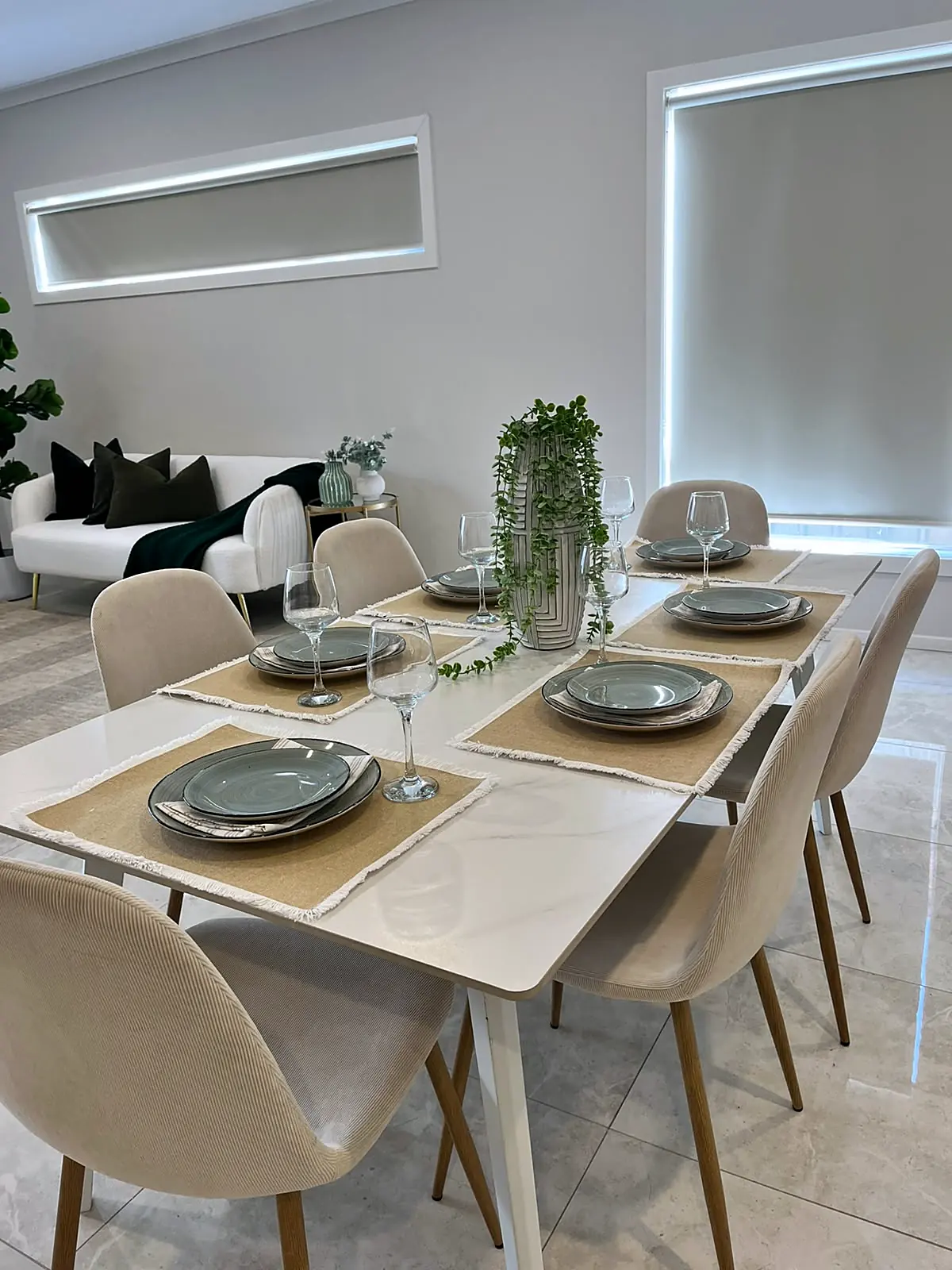 Dining table set for six in a staged Fraser Rise home