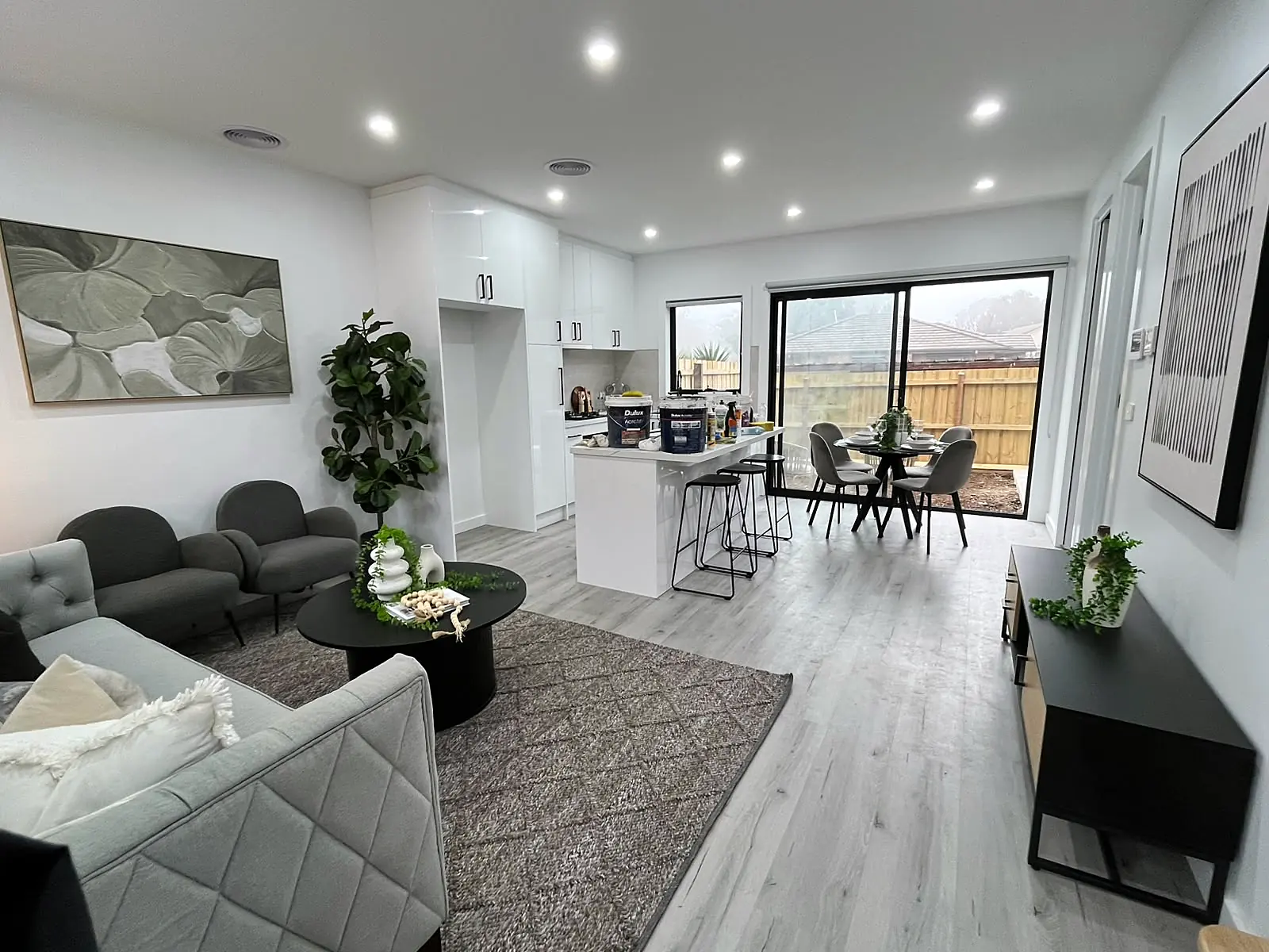 Open-plan living, dining and kitchen staged in a new Laverton home