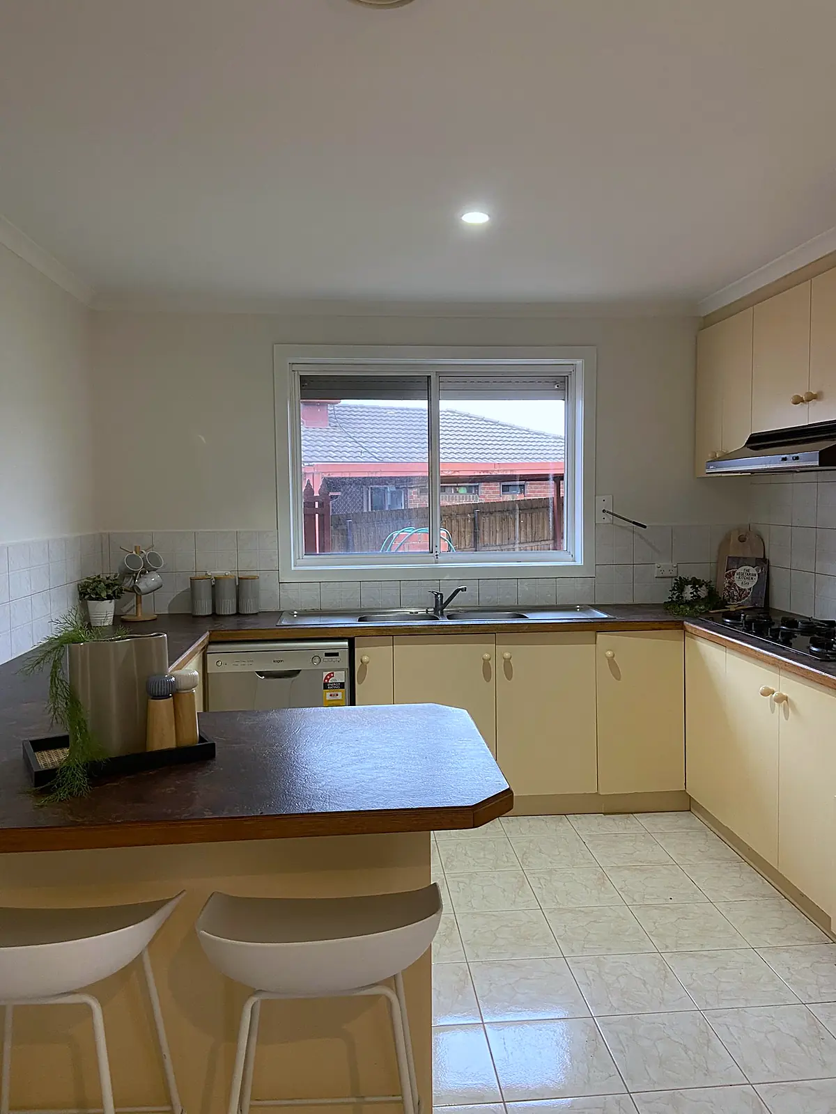 Kitchen with breakfast bar and stools styled in a Meadow Heights home