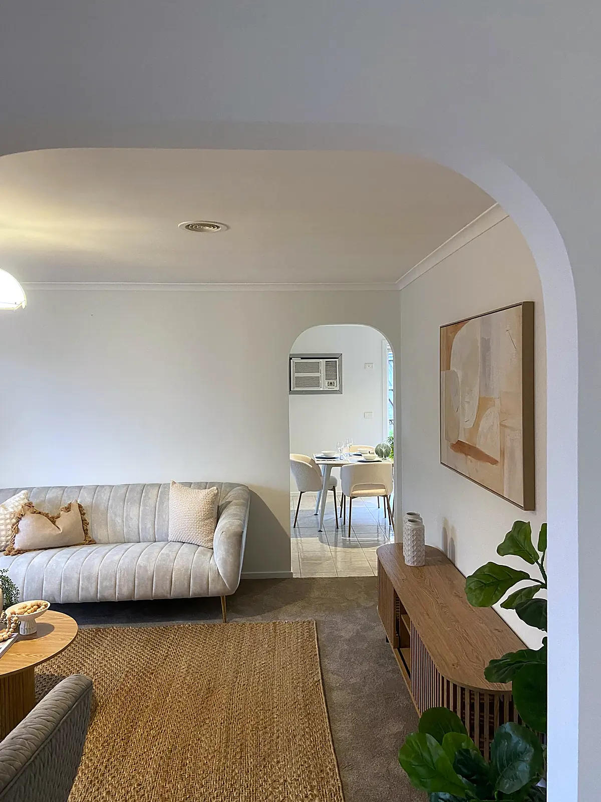 Archway view from the lounge to the dining area in a staged Meadow Heights home