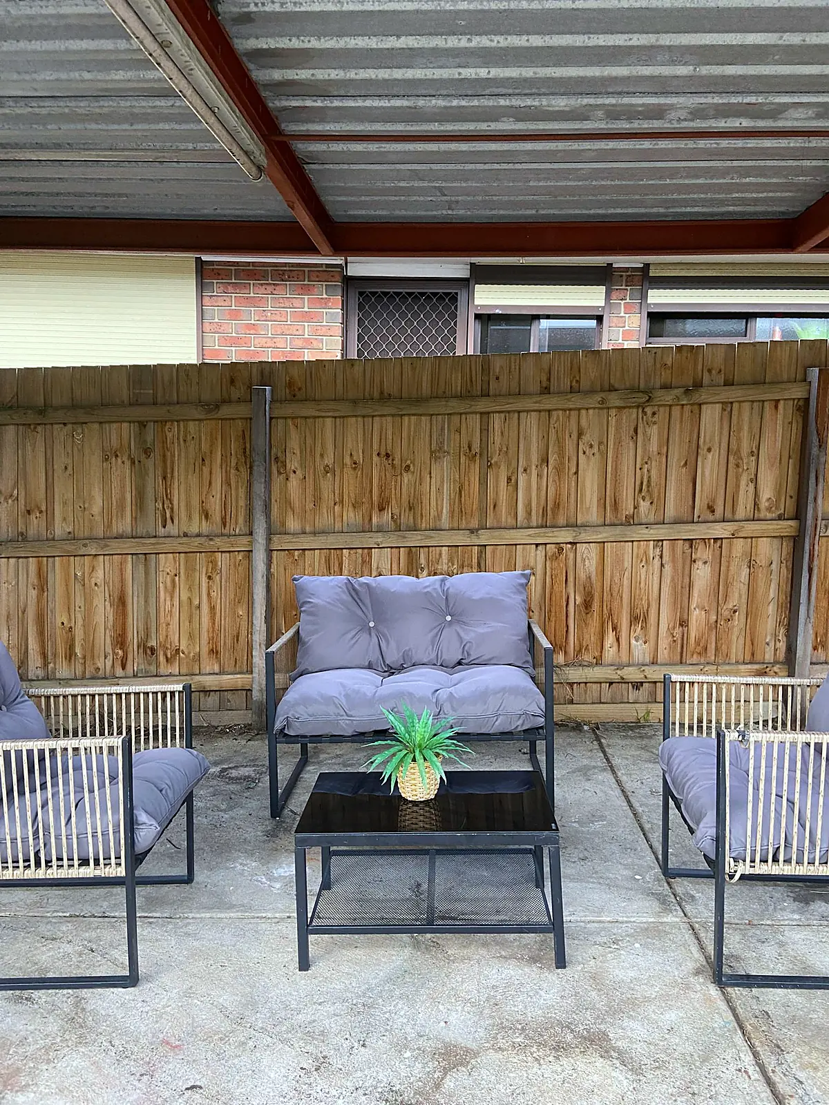 Covered outdoor area styled with a lounge setting in a Meadow Heights home