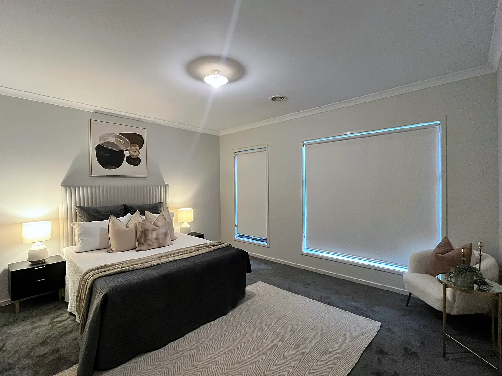 Master bedroom staged with armchair and floor rug in a Mernda home