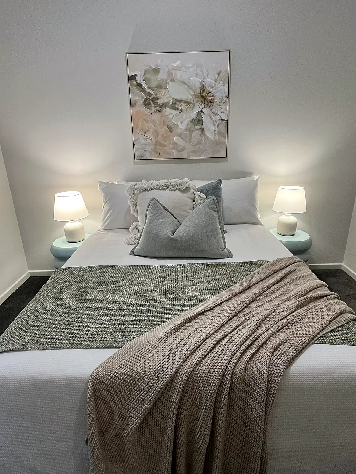Bedroom styled with grey cushions and floral artwork in a Mernda home