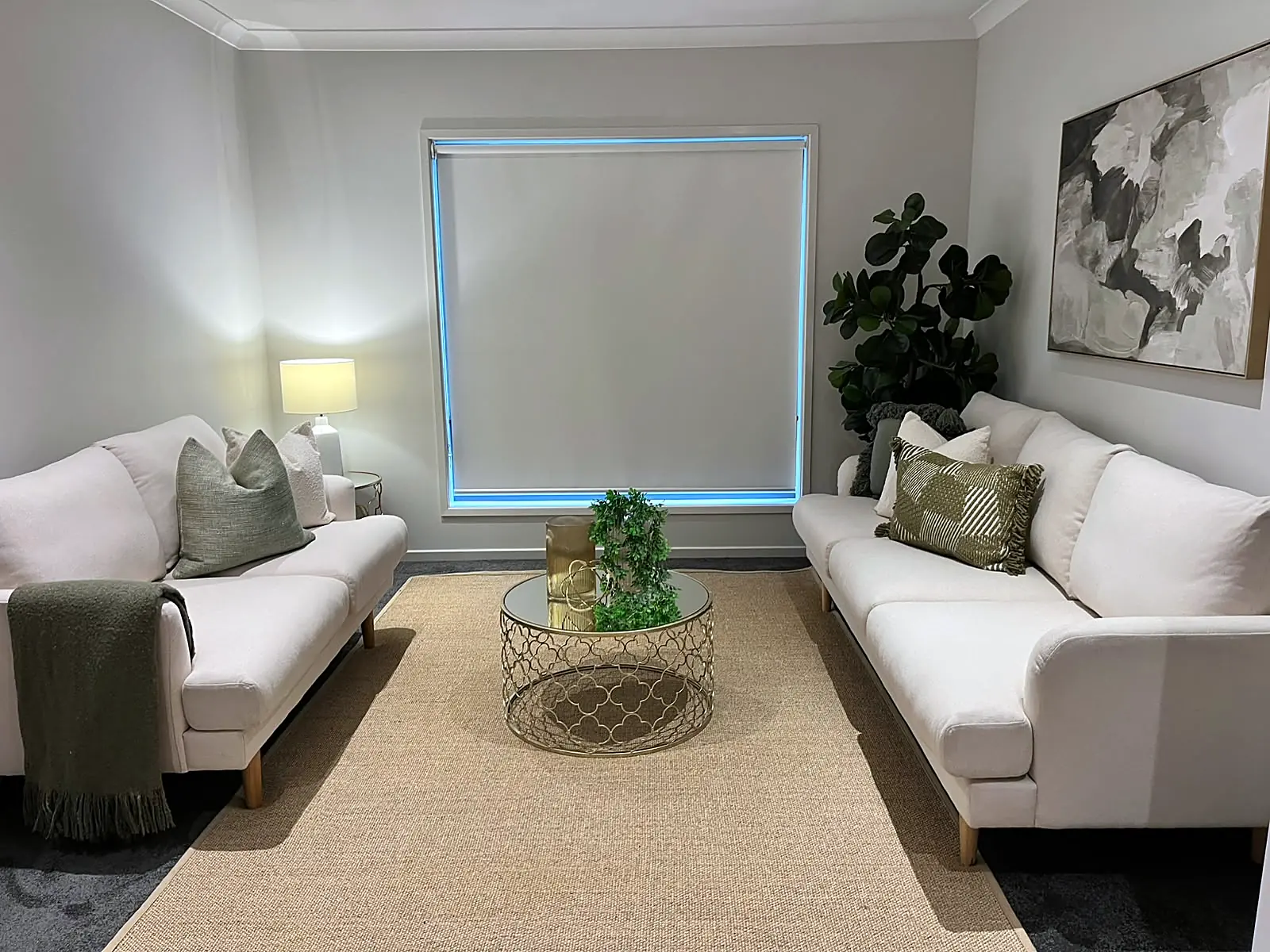 Front lounge staged with two white sofas and jute rug in a Mernda home