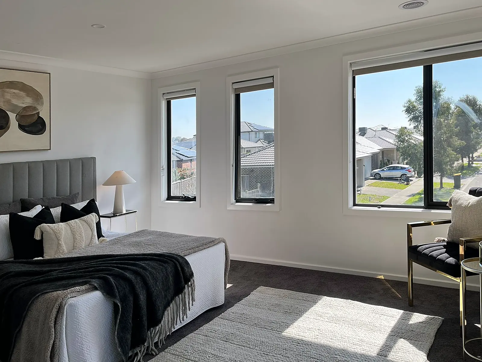 Main bedroom with sitting corner staged in a Mickleham home
