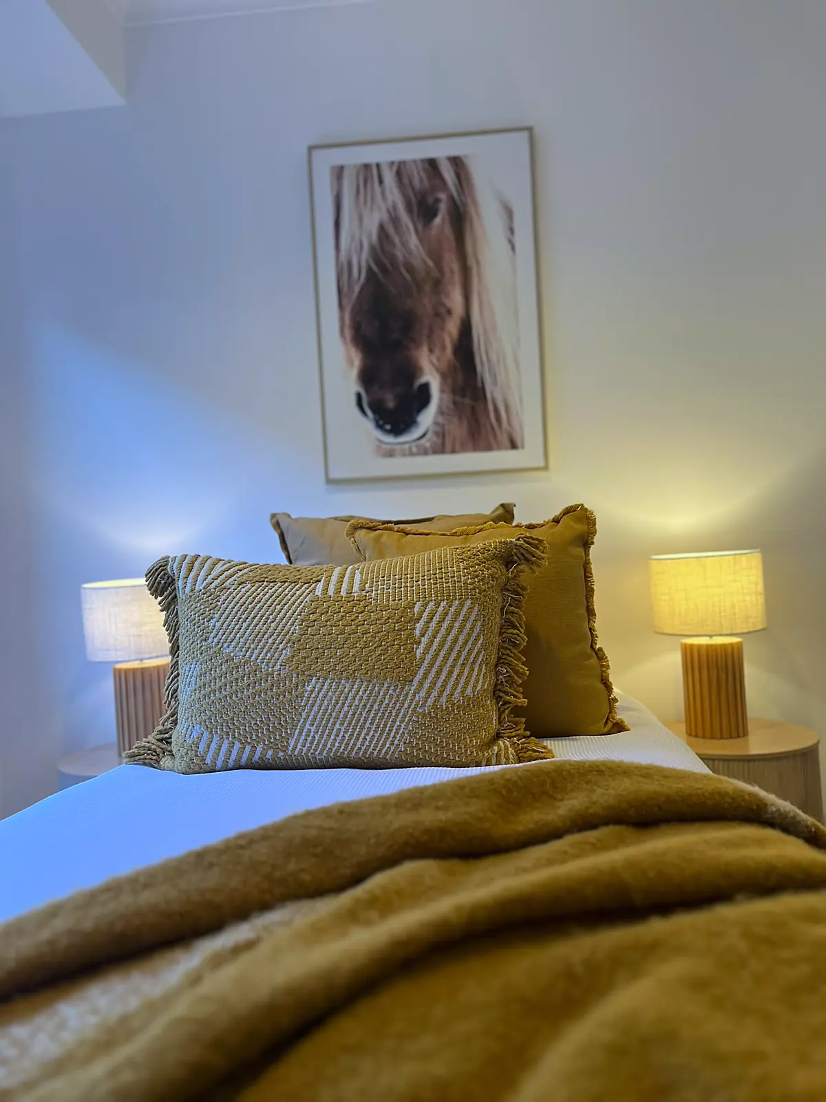 Bedroom staged with mustard throw and cushions in a Mill Park home