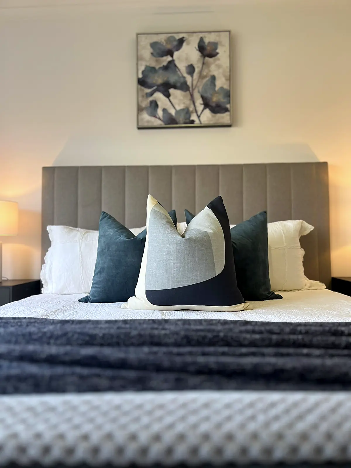 Main bedroom staged with grey bedhead and navy cushions in a Mill Park home