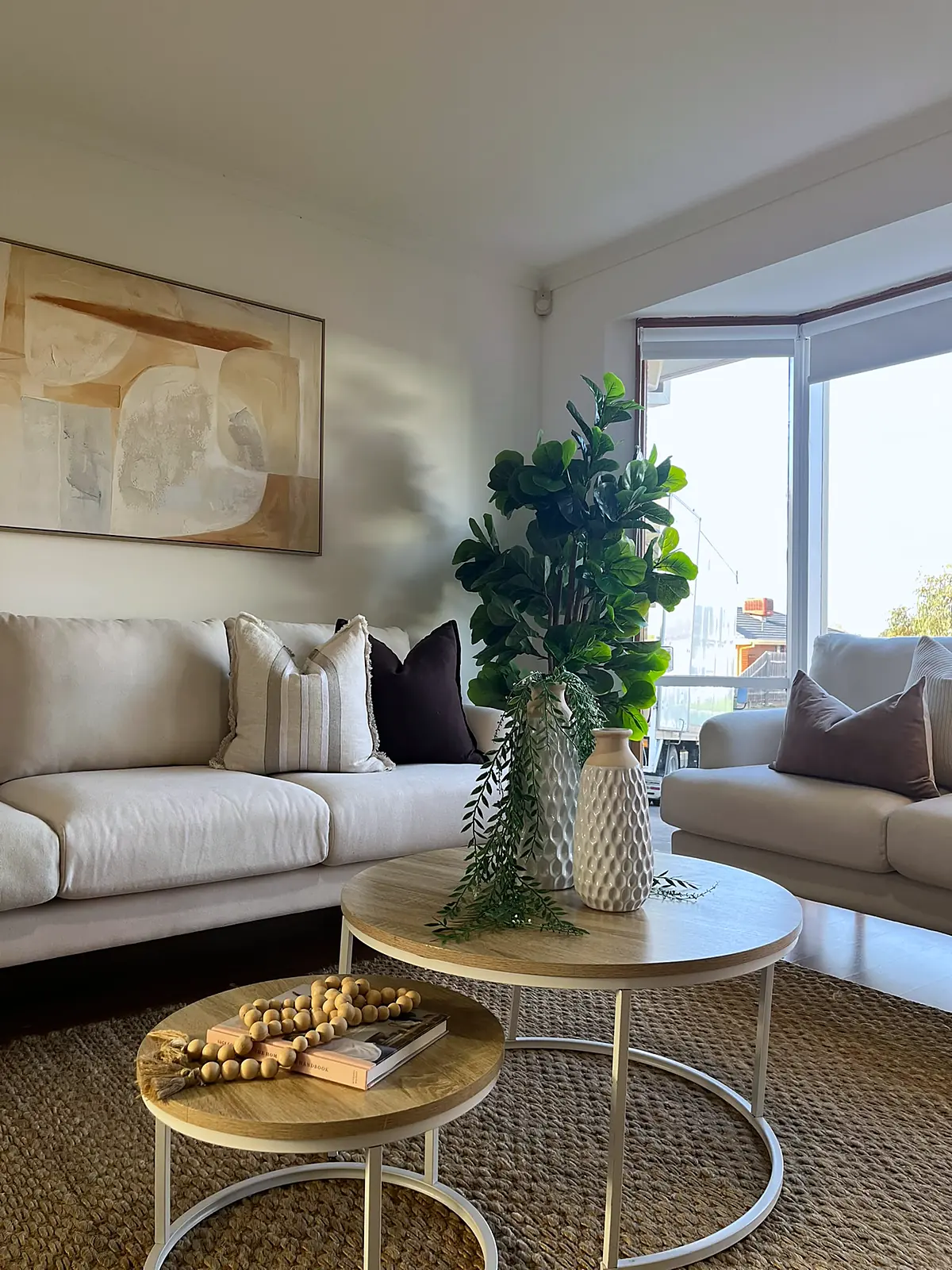 Nesting coffee tables and sofas in a staged Mill Park living room
