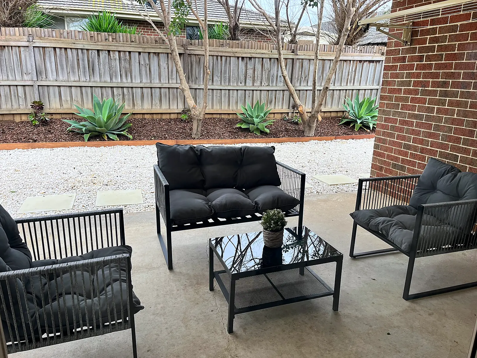 Covered outdoor area staged with a lounge setting in a Point Cook home