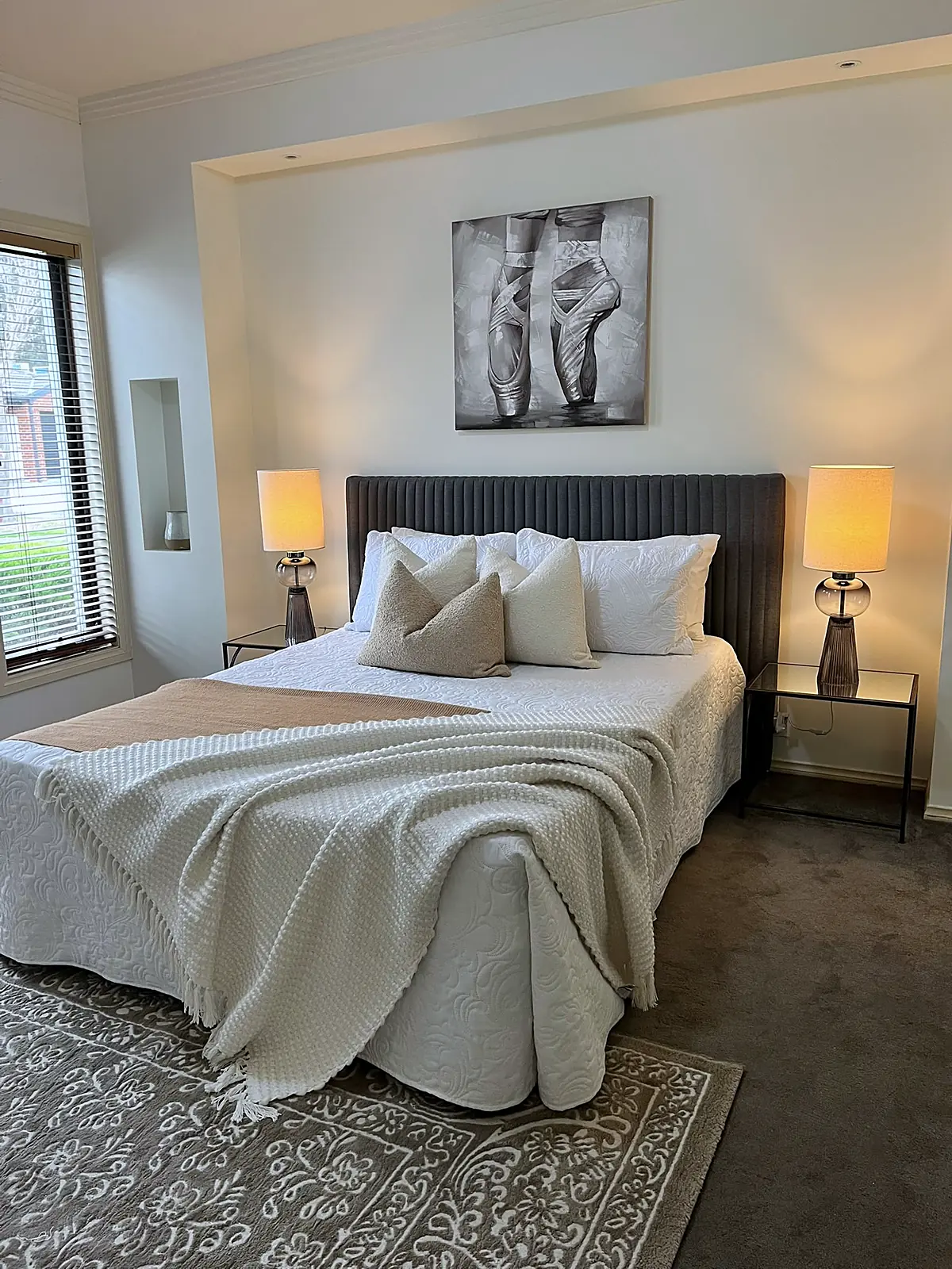 Master bedroom styled with layered linen and bedside lamps in Roxburgh Park