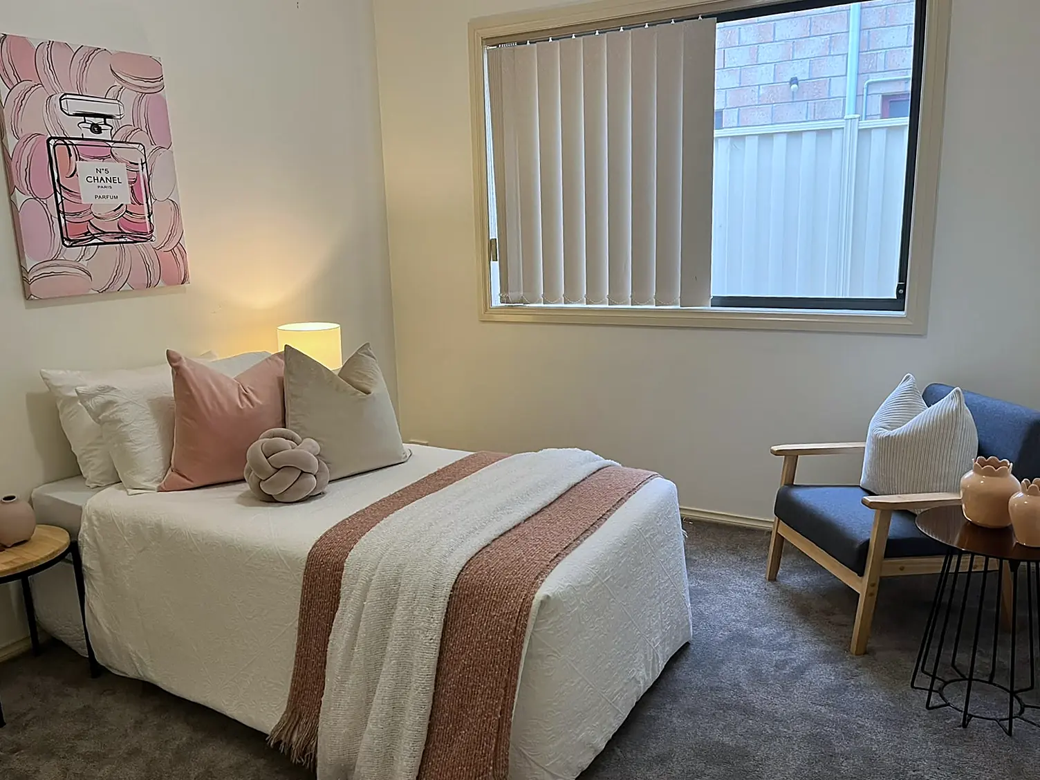 Single bedroom staged with armchair in a Roxburgh Park family home