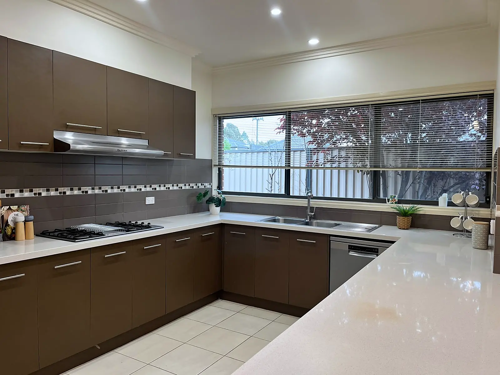 Kitchen with styled benchtops in a staged Roxburgh Park home