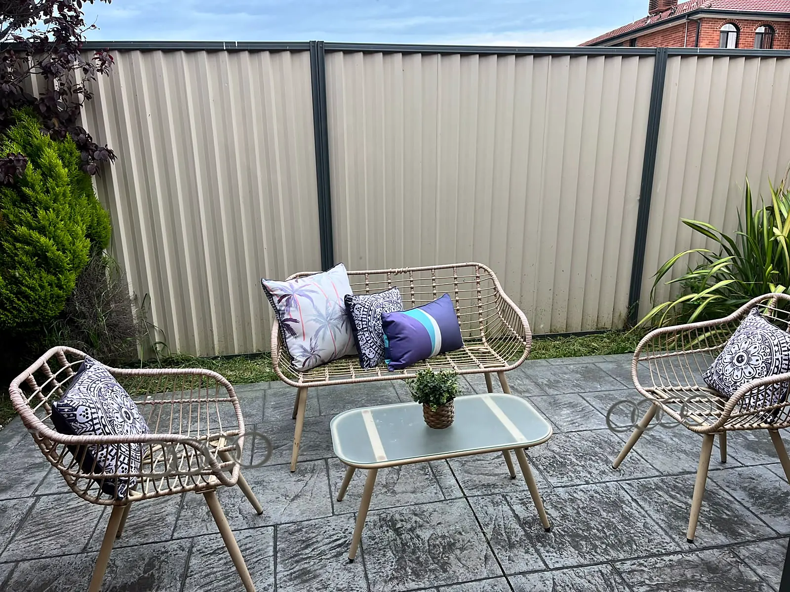 Courtyard styled with rattan outdoor setting in a Roxburgh Park home