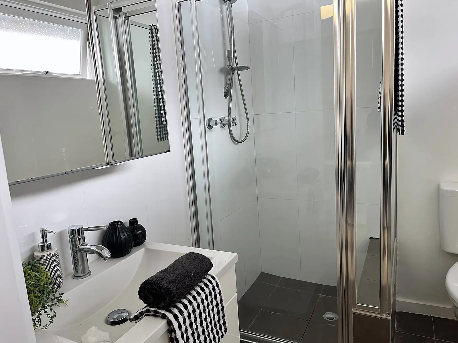 Bathroom styled with towels and greenery in a Thornbury unit