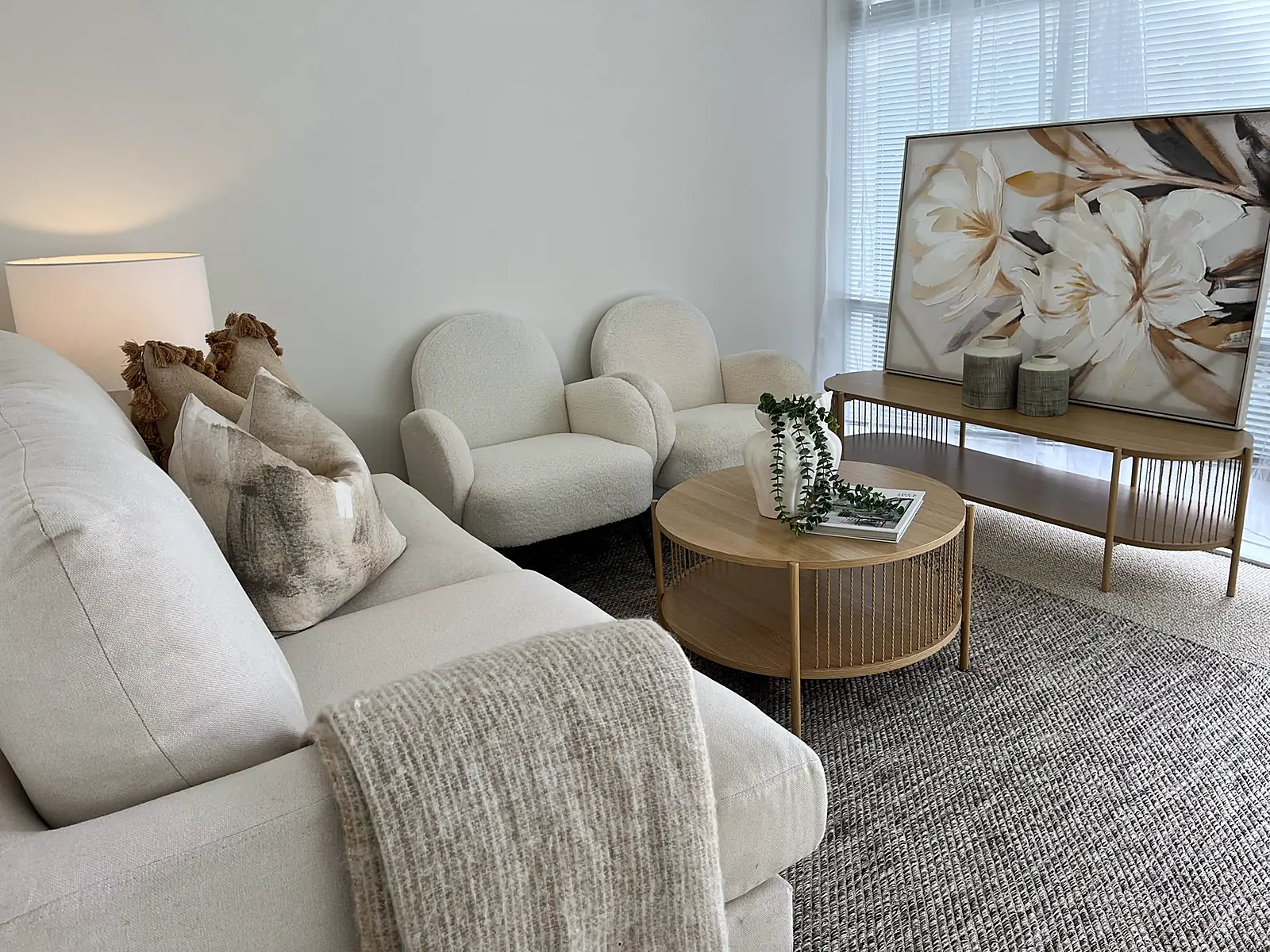 Armchairs and floral artwork in a staged Thornbury living room