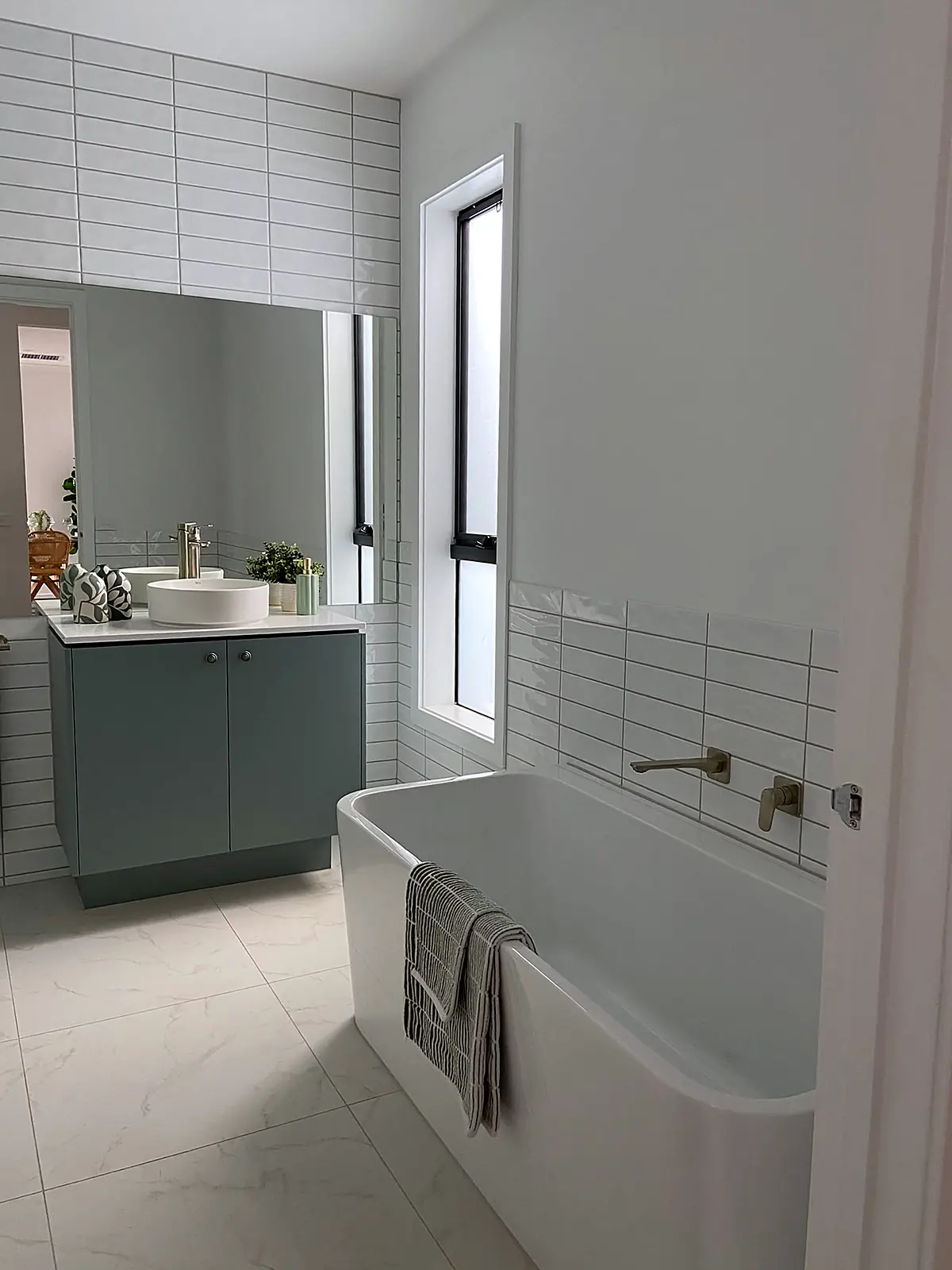 Bathroom with freestanding bath styled for sale in a Truganina home