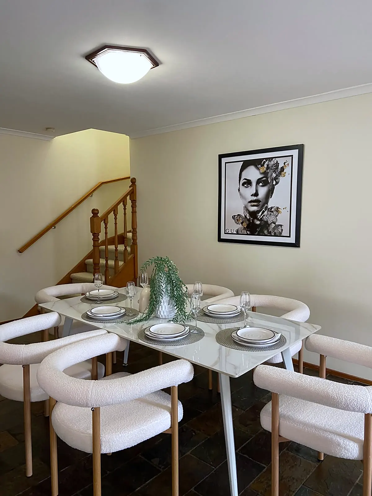 Dining area staged with white table and boucle chairs in a Watsonia home