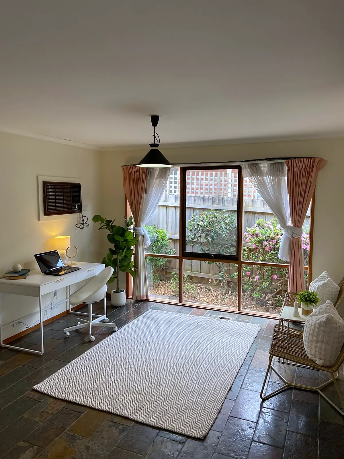 Sunroom styled as a home office in a Watsonia home