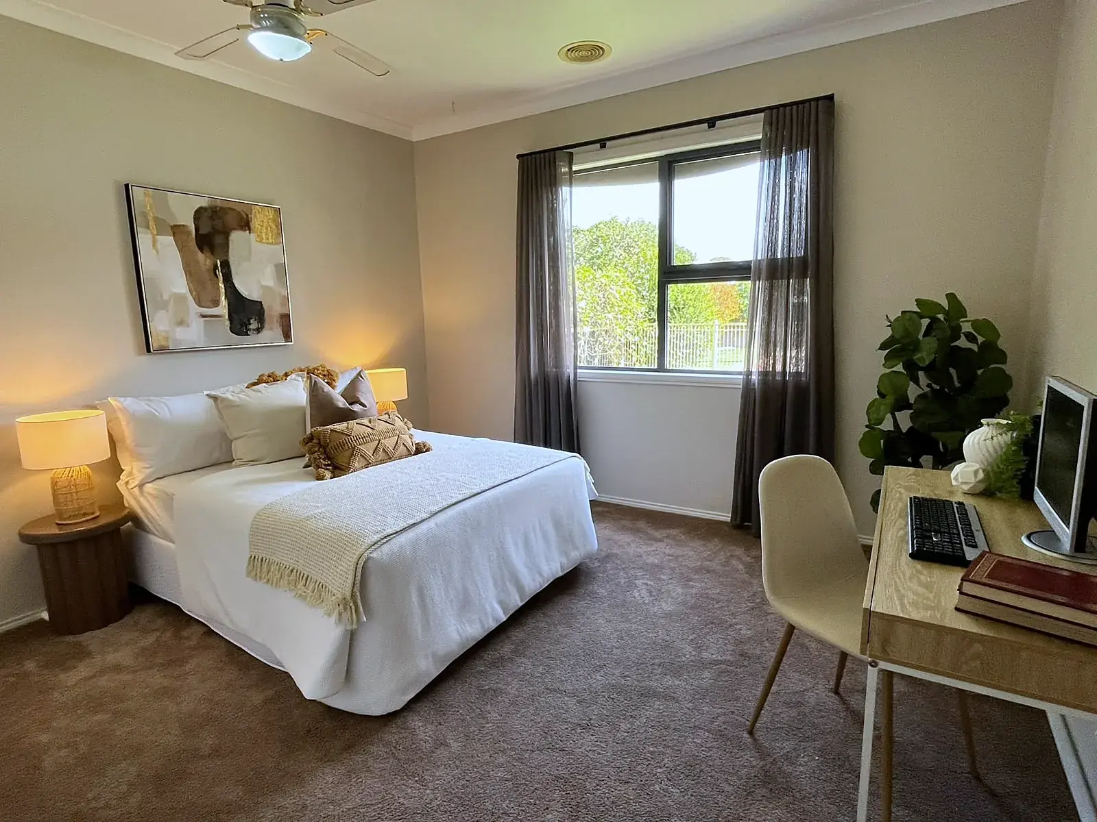 Bedroom staged with study desk and neutral linen in a Werribee home
