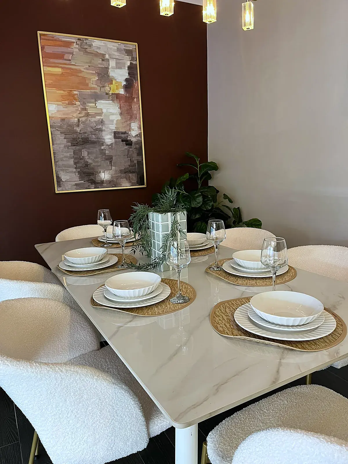 Dining room staged with marble-look table and boucle chairs in Werribee