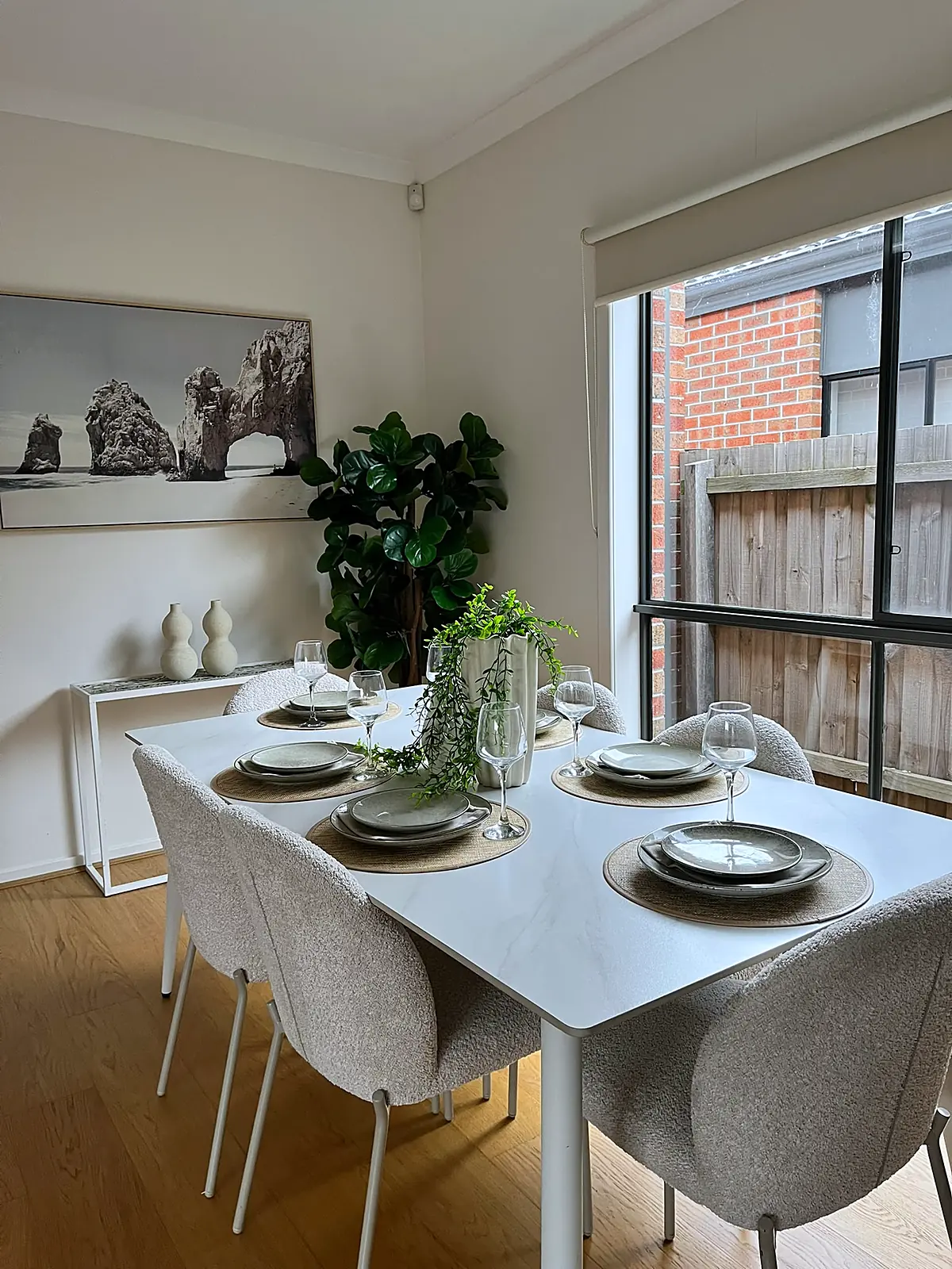 White dining table set for six in a staged Wollert home